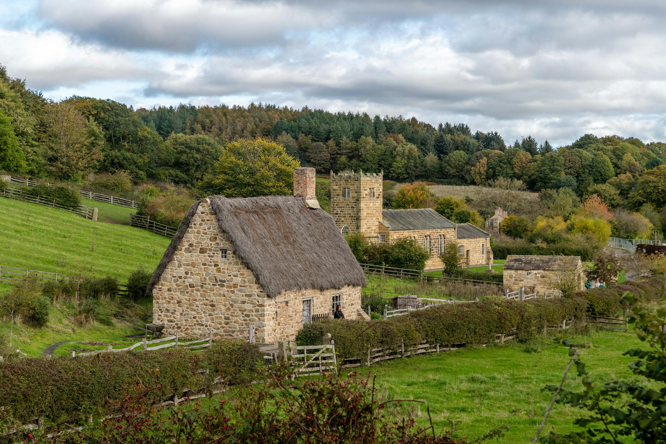 Beautiful rural landscape featuring a stone cottage and scenic greenery, perfect for a tranquil escape.