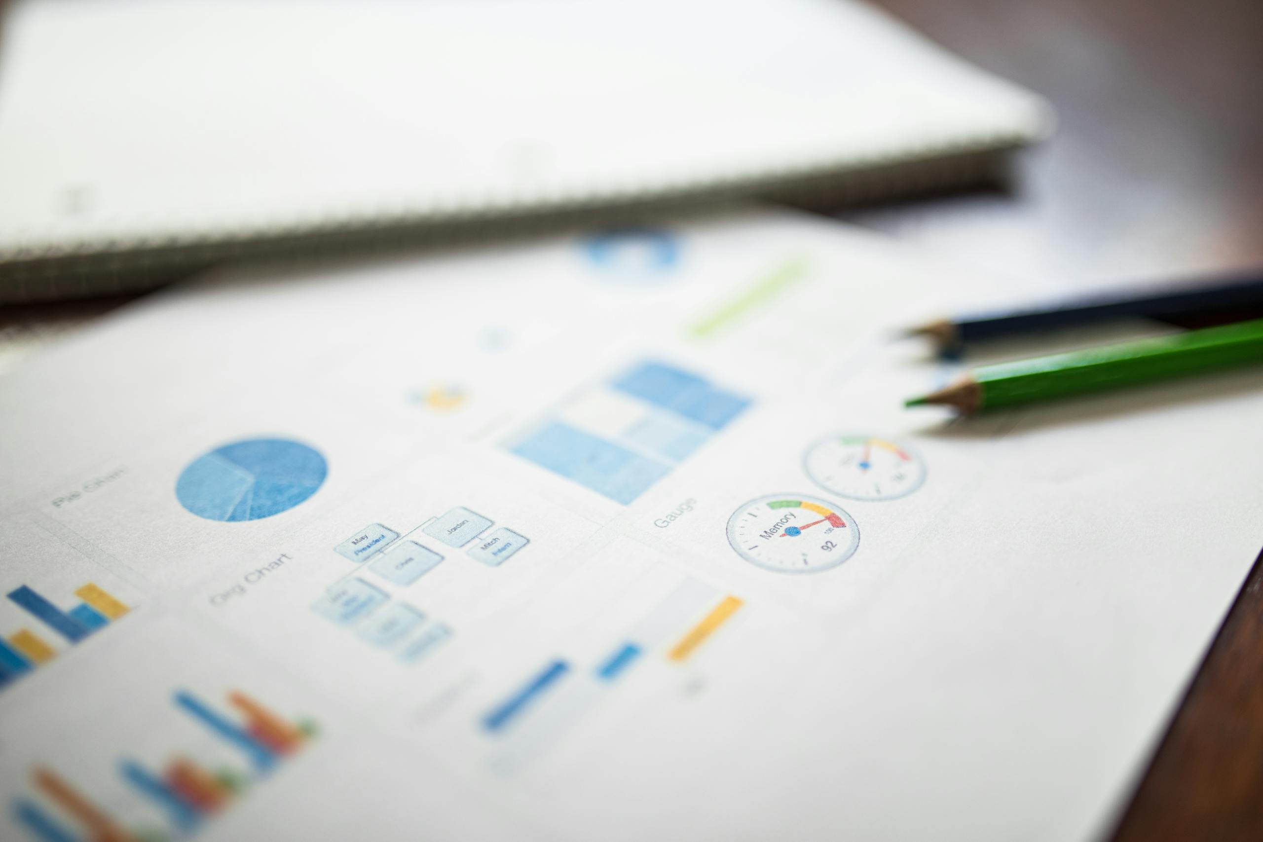 Illustration of a business financial report featuring various charts and graphs on paper.